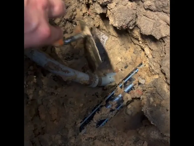 Excavated sewer line with pipe repair access for Plumber in Phoenixville, PA | Pottstown Plumbing Pros in Phoenixville, PA