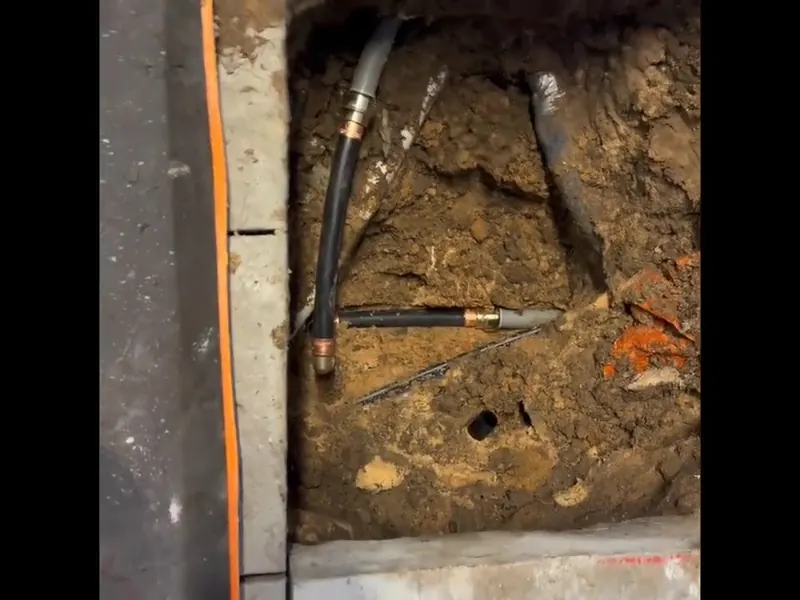 Excavated sewer line with pipe repair access for Plumber in the Riverfront District, Pottstown PA in Riverfront District, Pottstown, PA